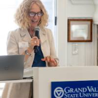 Provost Jennifer Drake speaking into microphone